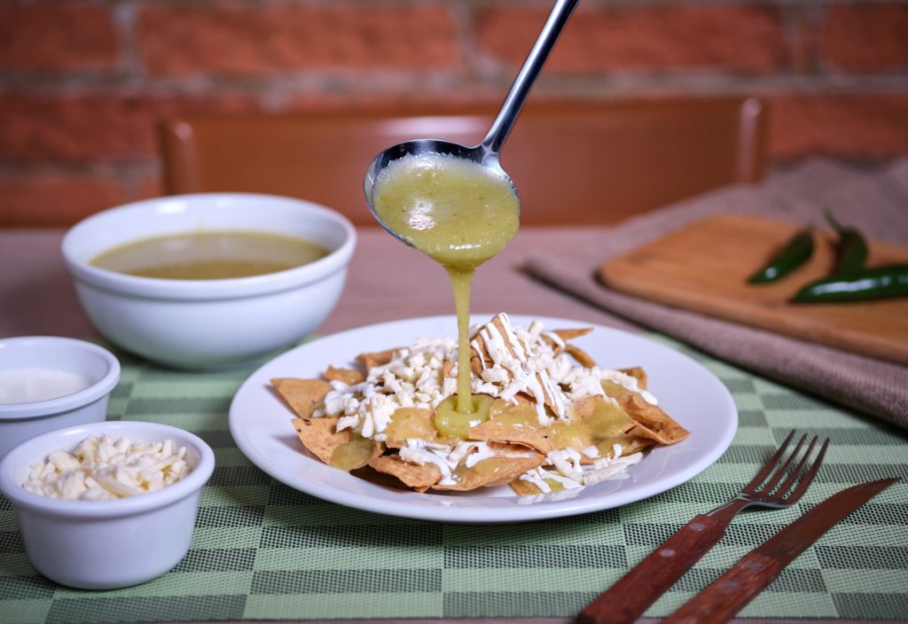 Photo of chilaquiles in green sauce illustrates blog: Are Chilaquiles Supposed To Be Crunchy?