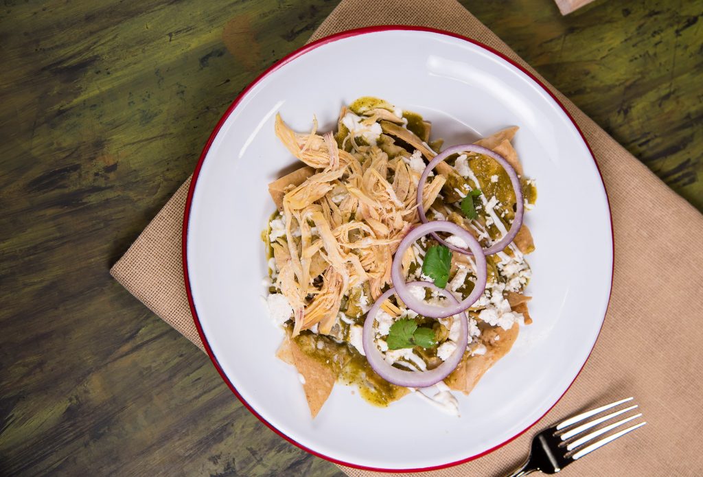 Photo of plate of chilaquiles illustrates blog: "Can You Make Chilaquiles With Flour Tortillas?"