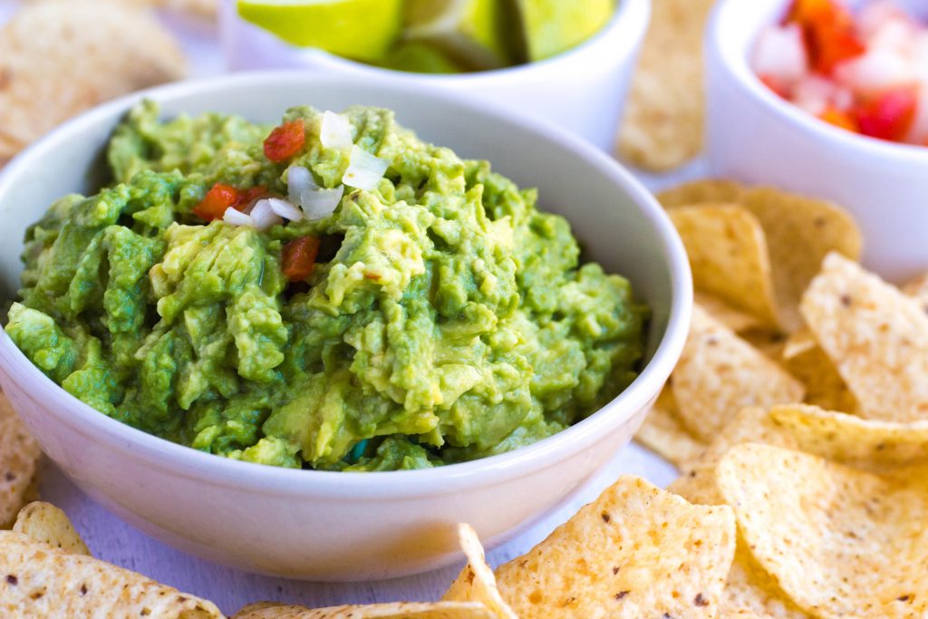 Bowl of guacamole illustrates blog "Guacamole vs Mole: What Is the Difference?"