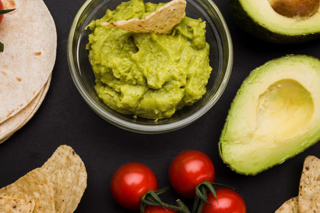 Bowl of guacamole illustrates blog "How To Pronounce Guacamole (With Examples)"
