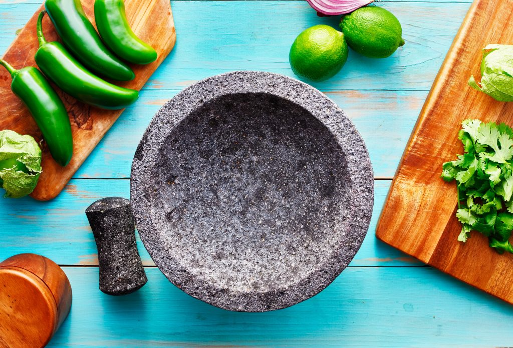 Photo of molcajete with jalapenos illustrates blog: "The Surprising Benefits of Jalapenos"