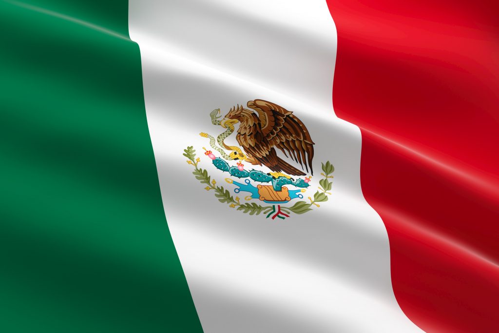 Photo of Mexican flag illustrates blog; "What Is the Origin of Cinco de Mayo?"