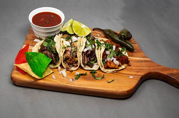 Image of tacos illustrates blog: "4 Dishes to Celebrate Mexico's Independence Day"