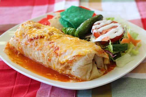 Picture of burrito covered in sauce illustrates blog: What is a wet burrito?