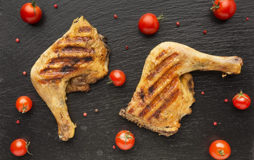 Grilled chicken with cherry tomatoes by its side.