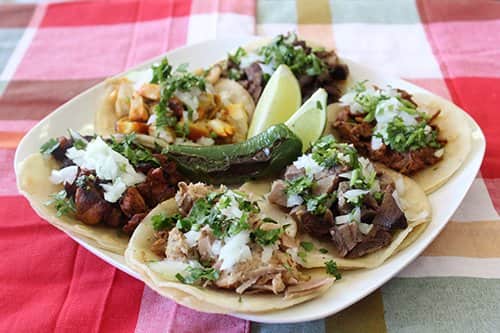 Taco platter illustrates blog "Is Al Pastor Chicken, Veal, or Pork?"